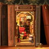 DIY Bookstore Book Nook Kit by Diokits Shown As Decoration In Middle Of Books