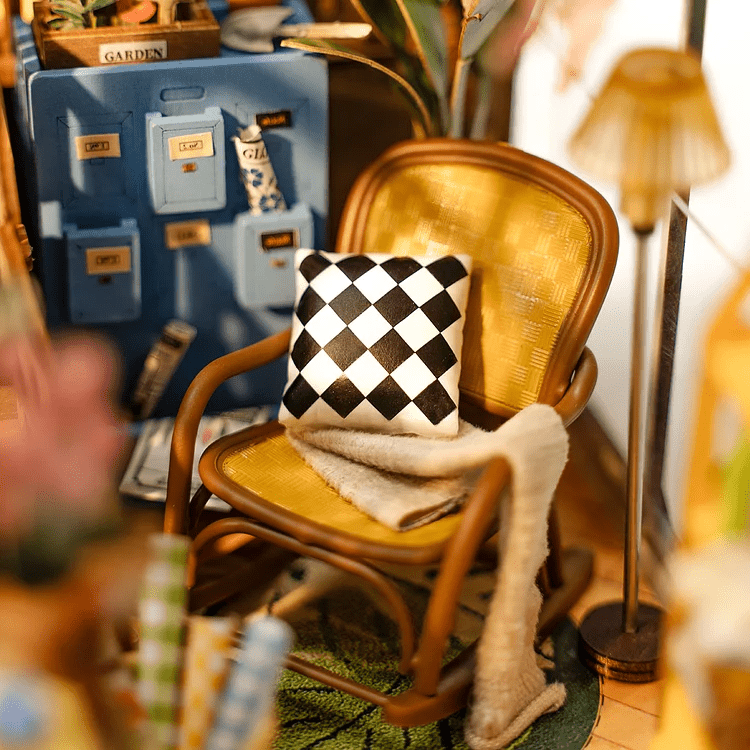 DIY Garden House Book Nook Kit by Diokits - Detailed Look Of A Chair With a Checkered Pillow