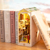 DIY Sunshine Town Book Nook Kit by Diokits - Front Angled View of Book Nook in Middle of Books