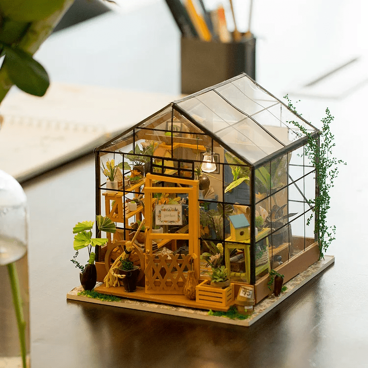 Cathy’s Flower House DIY Miniature House Kit by Diokits Shown As Decoration On Top Of Table