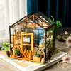 Cathy’s Flower House DIY Miniature House Kit by Diokits Being Shown As A Home Decoration