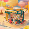 Rainbow Candy House DIY Miniature Kit by Diokits - Front View With Town Background