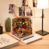 Sam's Study Library DIY Miniature House Kit by Diokits - Front View On Table With Lamp On The Side